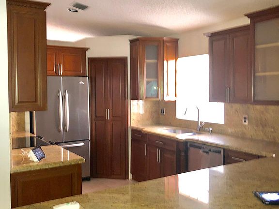 SS appliances. Fridge with interior ice maker. Garbage disposal. Dishwasher. Corner pantry. Microwave and stove/oven