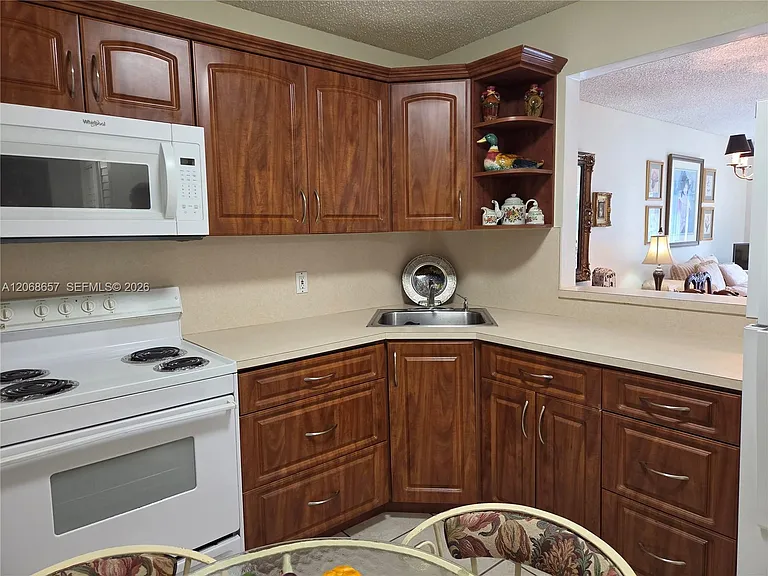 7707 Camino Real #B-209 — Photo 11