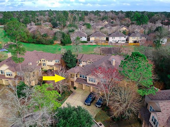 The lush greenbelt is right behind the condo building.