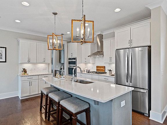 Beautiful kitchen with breakfast bar and stainless steel appliances