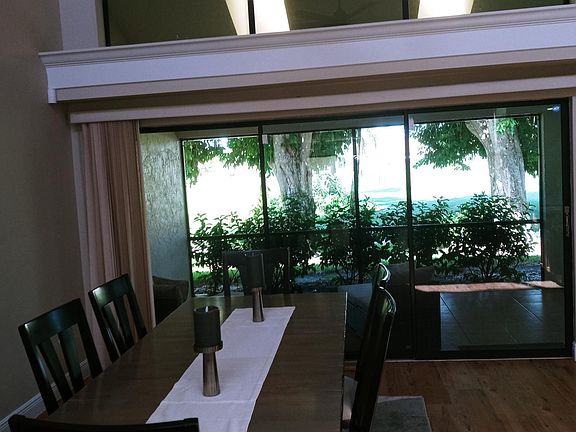 Dining room with view of part of the lanai and slider to enter lanai