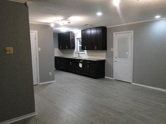 Den looking into new kitchen