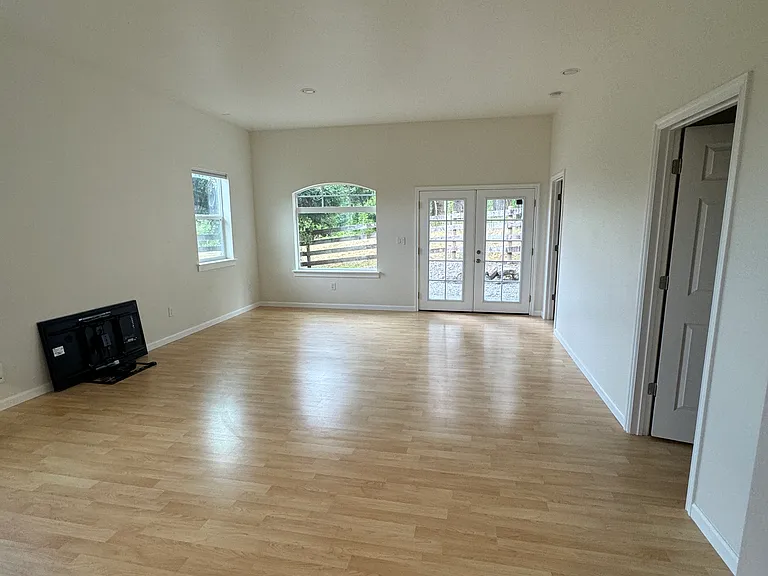 Open concept living room. TV is mounted now and can be included. You are responsible for internet