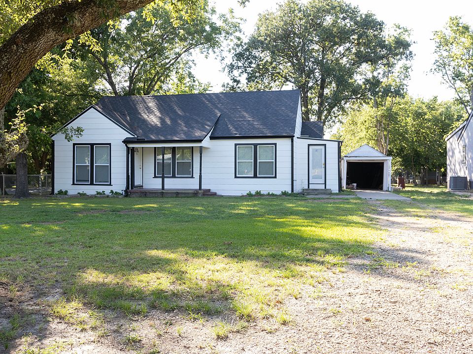 This Property has a Large Front yard and Extra Large fenced in Back Yard with a Driveway and a One Car Garage.