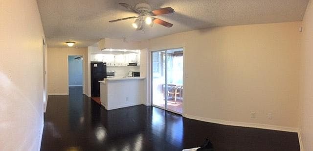 Entrance to unit, living room and kitchen.