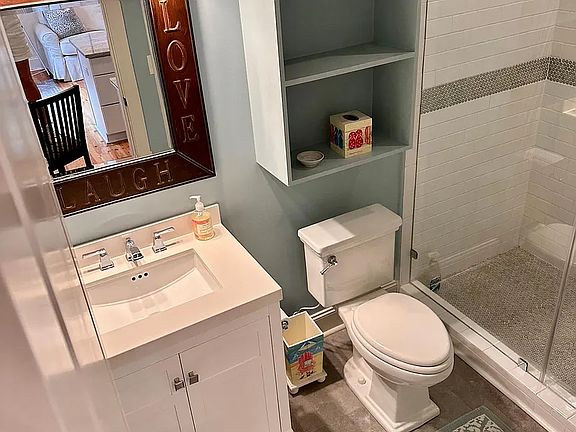 Very large rain shower (not shown). full bath with stone floors.