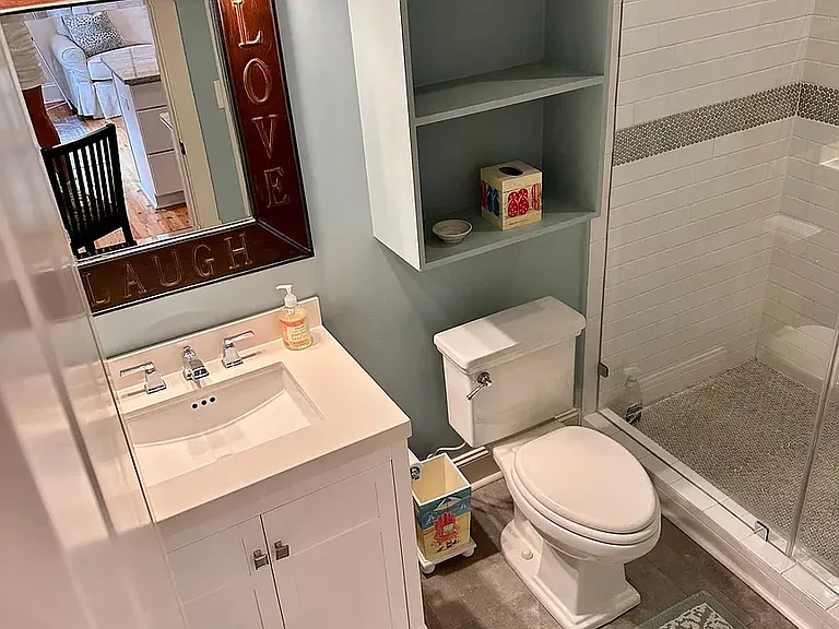 Very large rain shower (not shown). full bath with stone floors.