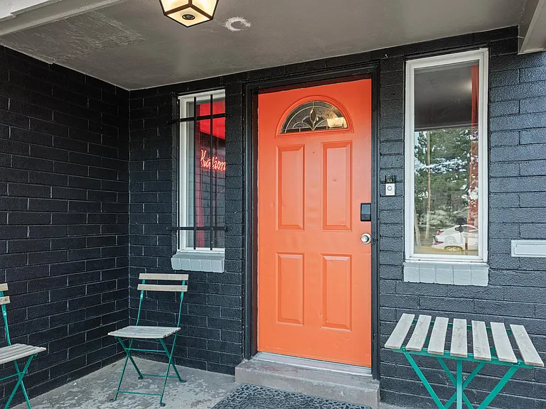Our dark gray exterior conceals a world of pleasant surprises and comfort waiting to welcome you.