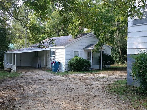 Rear house and carport.