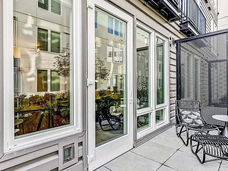 Griffis Shoreline apartment balcony with lounge chair.