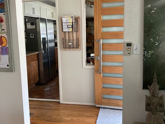 View from Living room via entryway into kitchen
