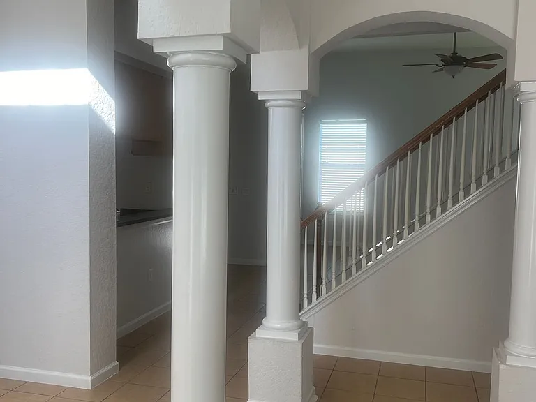 68 - Decorative interior columns framing hallway.
