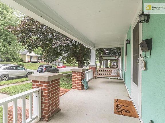 Adorable front porch with swing!