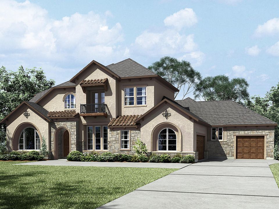 custom two-story home with stone and stucco exterior and covered entry