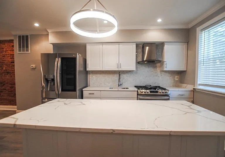 Walk in to an open first level; head to the back of the house to find the upgraded kitchen