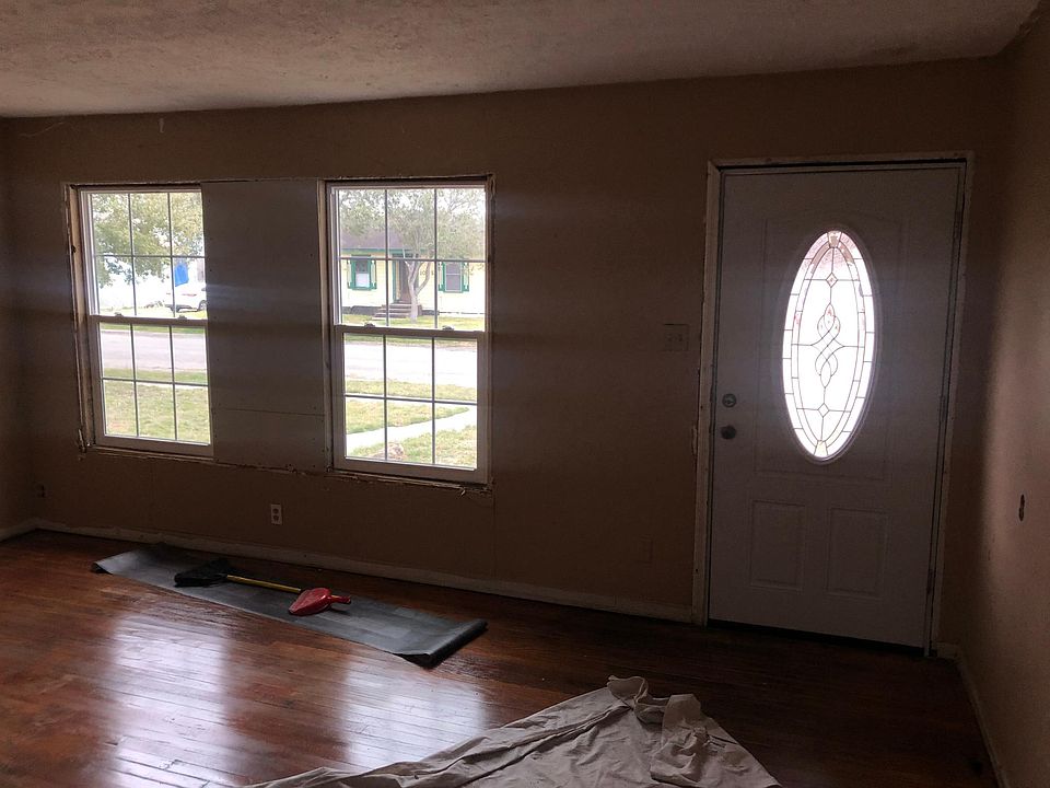 Living Room new windows and door. Oak floor sealed and polished.