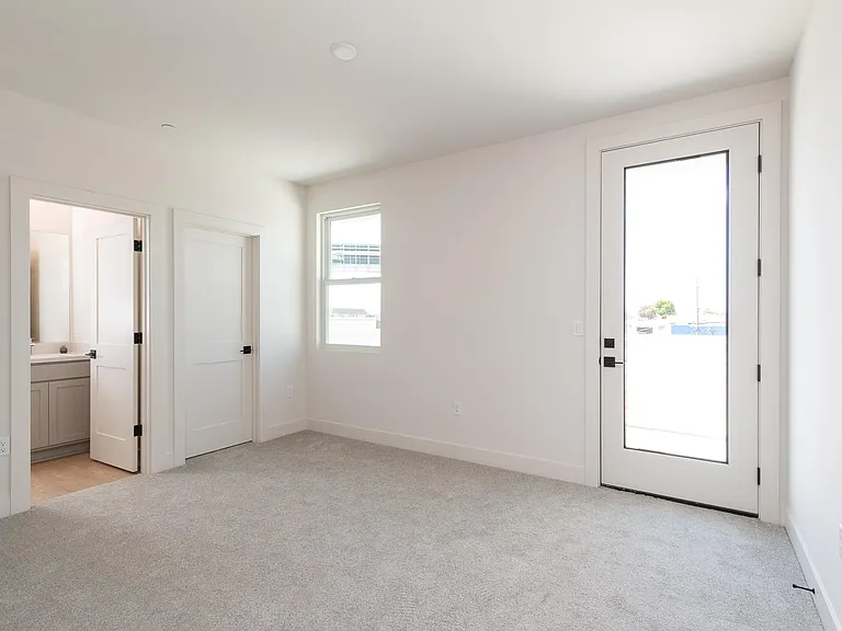Primary Bedroom with ensuite Bath, Private Deck and walk-in Closet.