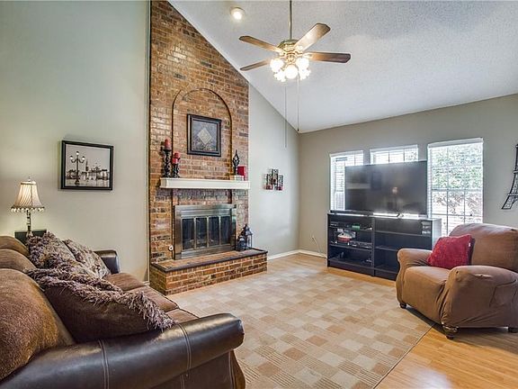 Spacious living room with laminate wood floors.