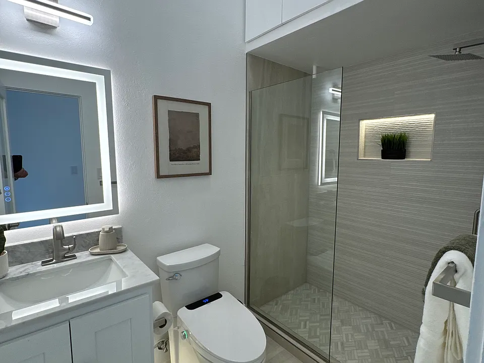 The main level bathroom features gorgeous LED lighting and clean lines.