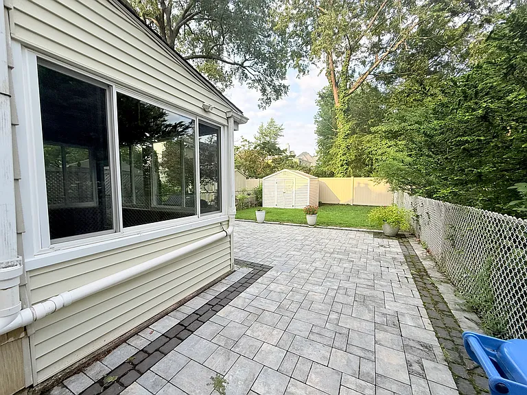 Fenced in Backyard with Paver Patio, Grill, and Shed