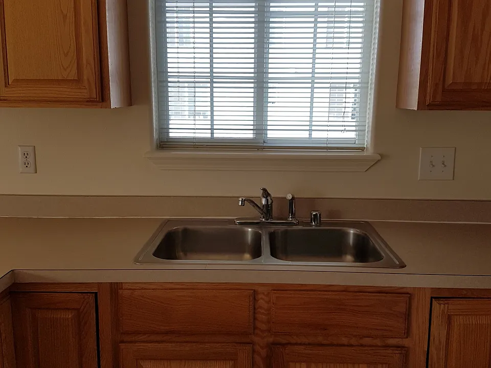 Sunny window over the kitchen sink makes doing dishes a litt