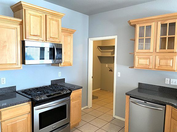 Kitchen through to laundry, small home office, & exit to Garage.