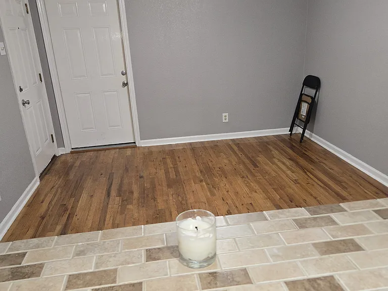 Looking thru opening to the living room with little shelf area