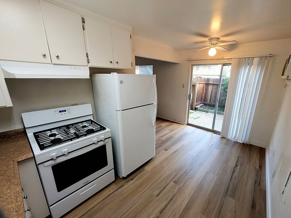 kitchen with fenced patio beyond