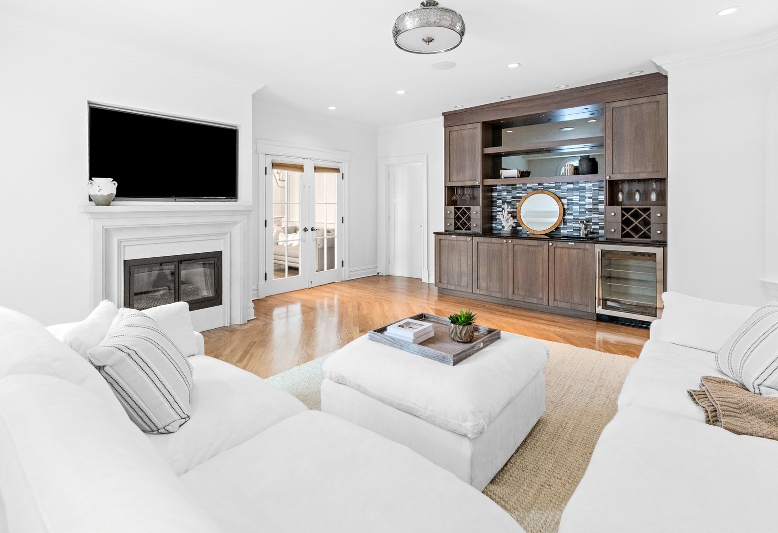  Private den with dry bar, wine fridge & French doors—perfect for relaxing or entertaining