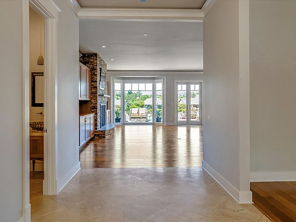 Entry hall with view of great room and 1/2 guest bath.