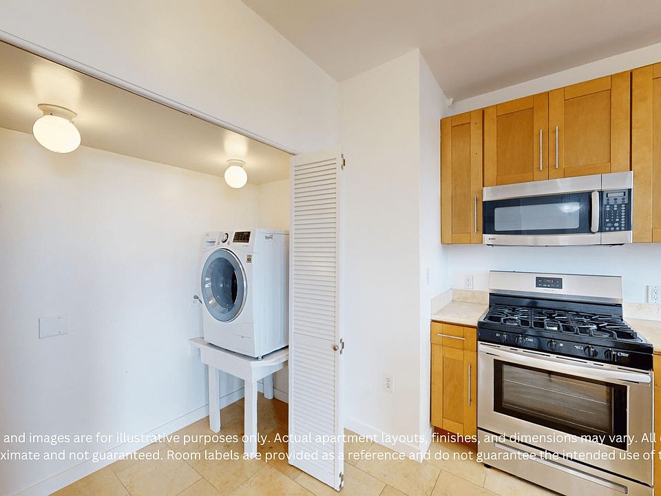 Bright, modern kitchen with wooden cabinets, stainless steel appliances, and a laundry area with a washer nearby.