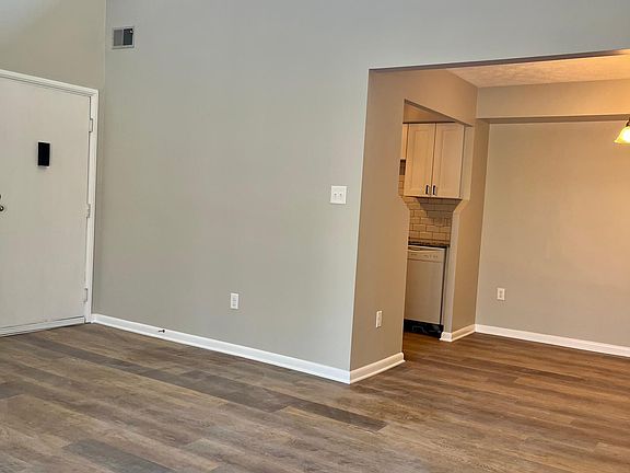 Living room looking into dining room and kitchen