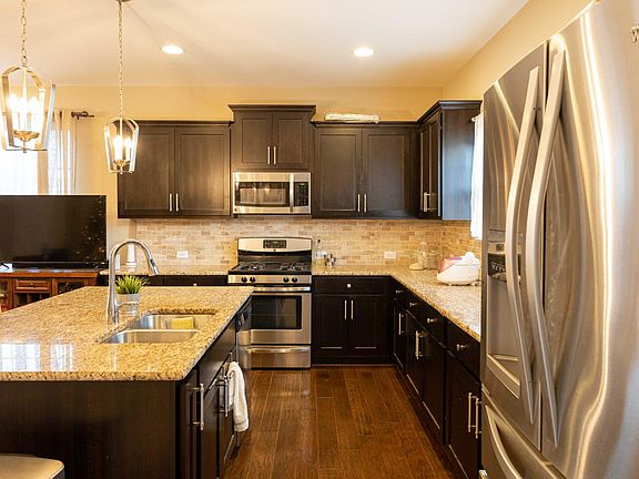 Kitchen with SS Appliances and Granite Countertops