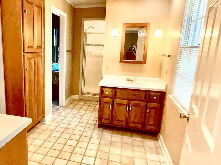 View to the combination of the walking closet, shower, bathroom, and the office/meditation room for the main master bedroom in the main floor. It is a suite in the main floor next to the other entrance door.
