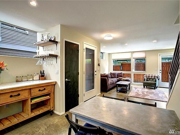 Kitchen and living room. The bar table stays.