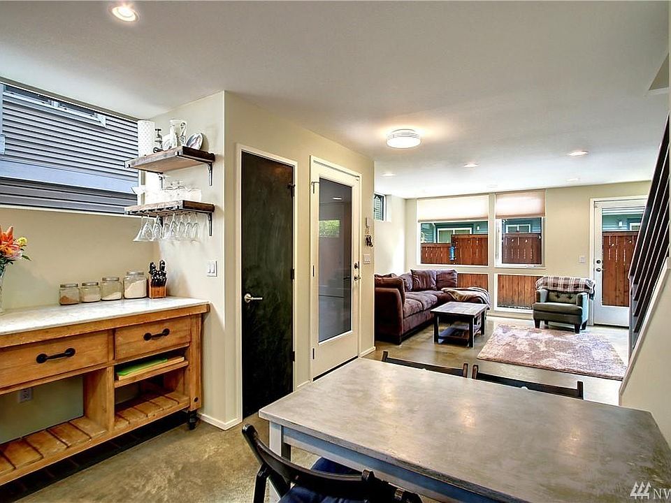 Kitchen and living room. The bar table stays.