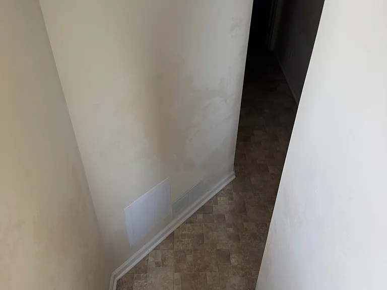 Stairs connecting the laundry room & garage (basement) to the main entrance