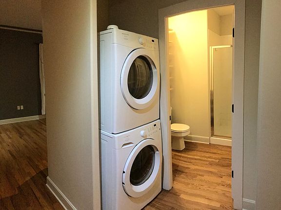 Stacked washer and dryer included.