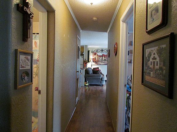 Long hall leading from bedrooms to living area