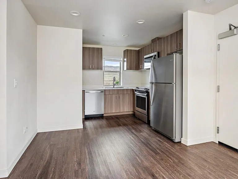 Kitchen with Washer and Dryer in closed cabinet (hidden) and a little space for breakfast area