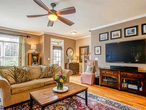 Living room opening out to balcony with mountain views and beautiful sunsets