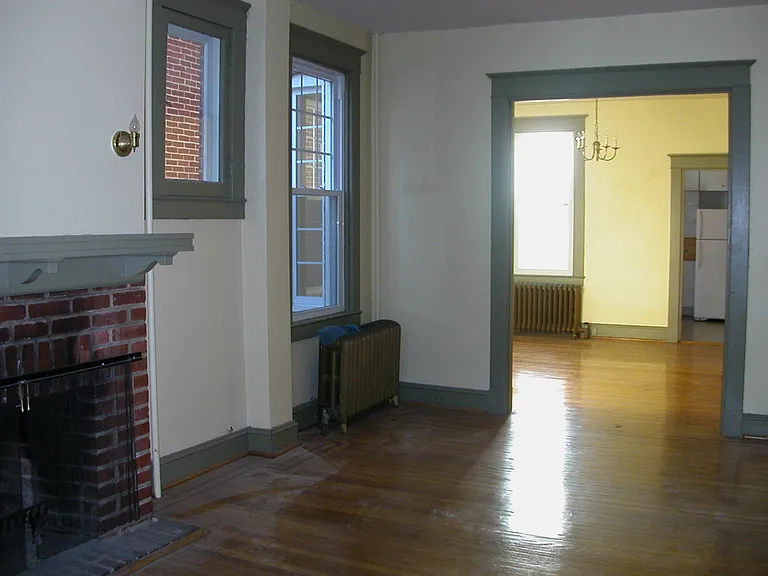 Similar view from living room into dining room. Porch is at your back, kitchen and bedrooms ahead.