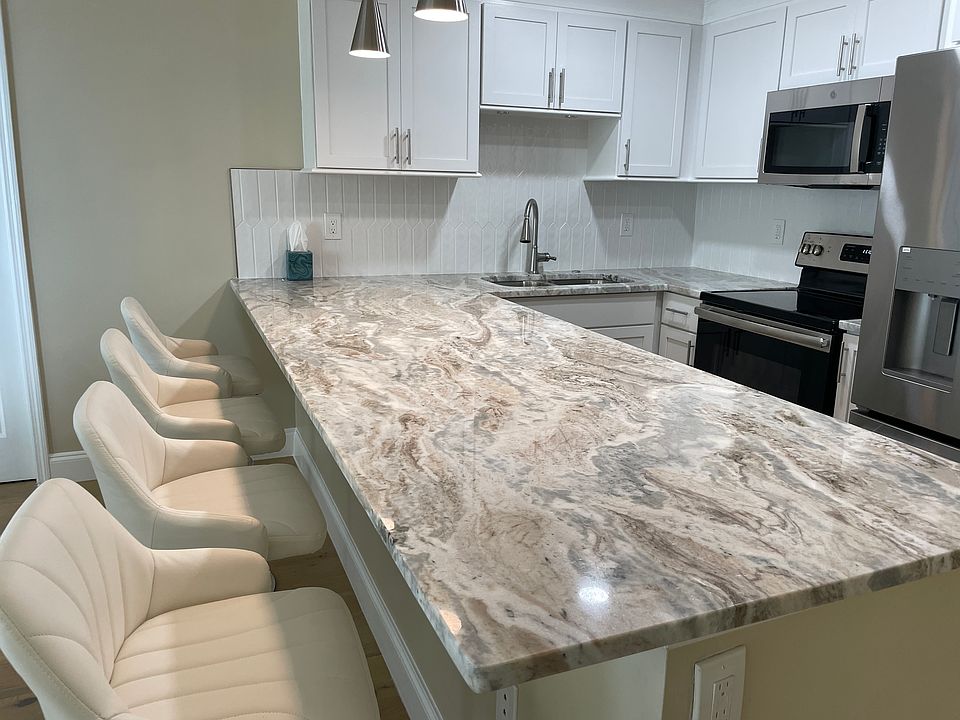 Updated kitchen with granite counters and stainless appliances