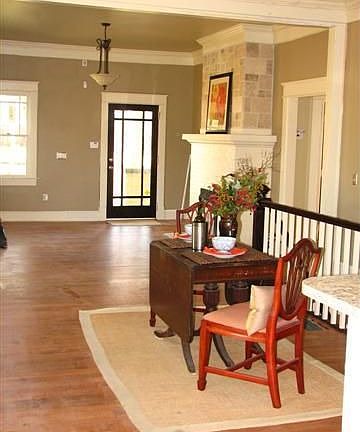Dining & living rooms with hardwoods & fireplace.