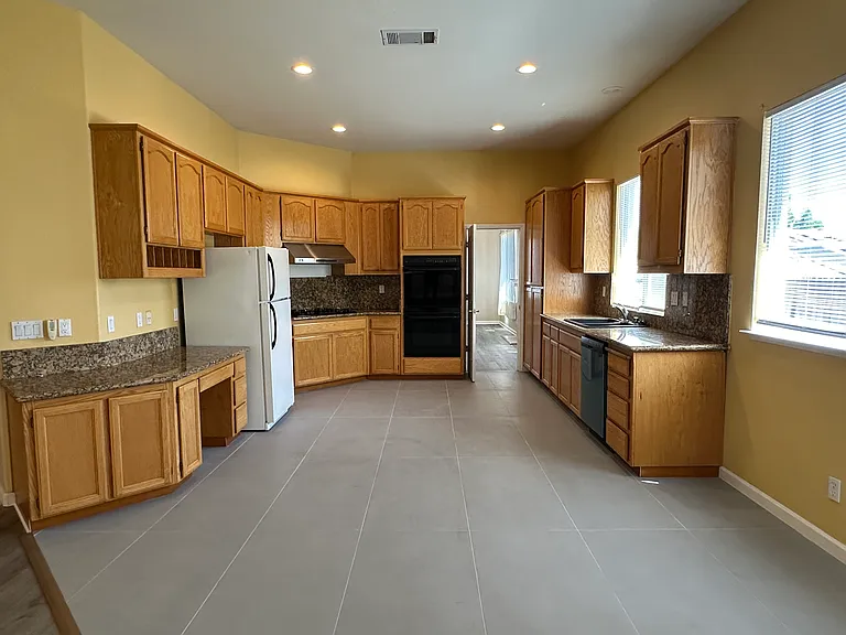Kitchen with Granite counters and Oak Cabinetry