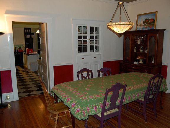 Formal dining room with original built-ins and fireplace.