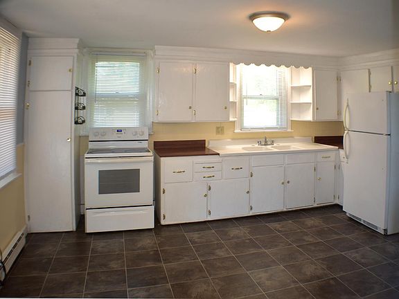 Large, bright kitchen with lots of cabinets. Appliances included.