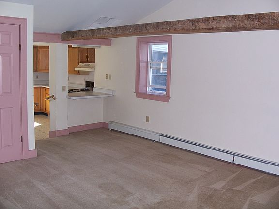 living room with exposed beam