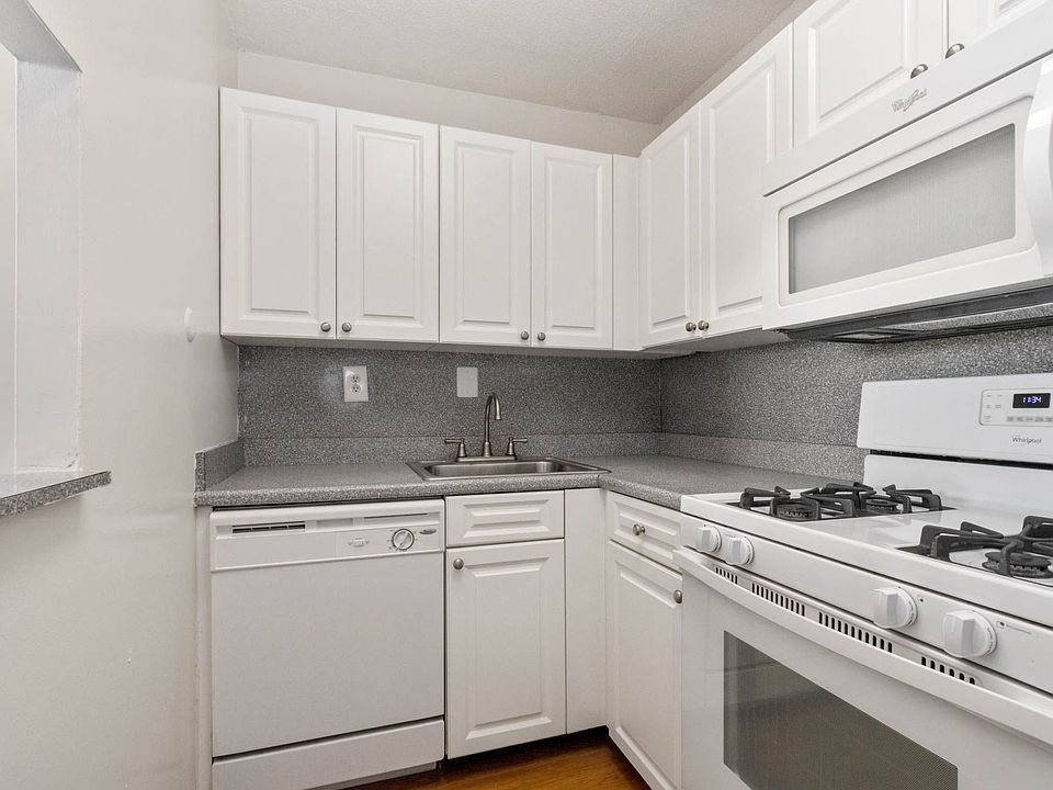White on white kitchen with gas cooking
