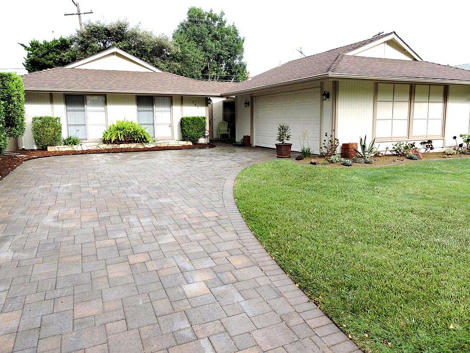 Paver stone driveway and room for extra parking.